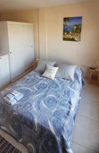 Ένα ή περισσότερα κρεβάτια σε δωμάτιο στο Monoambiente Exclusivo