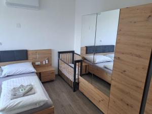 Posteľ alebo postele v izbe v ubytovaní Apartmány Lucie