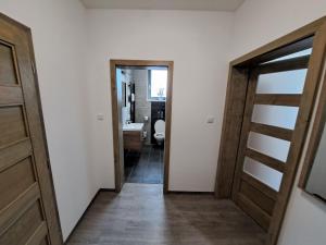 Posteľ alebo postele v izbe v ubytovaní Apartmány Lucie