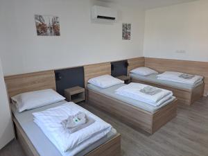 Posteľ alebo postele v izbe v ubytovaní Apartmány Lucie
