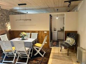 a dining room with a table and chairs at Holiday apartment Kutscherstube in Altenbeken