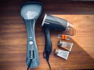 a hair dryer and a blow dryer on a table at Platforma2b eco in Šiauliai
