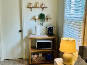 a room with a table with a microwave and a lamp at Homey little Suite in Columbia TN in Columbia +6 photos