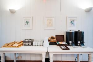 a white room with a white table with a appliance at Loi Flats Buenos Aires in Buenos Aires