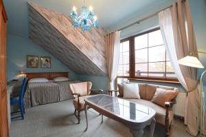 Postel nebo postele na pokoji v ubytování Hotel Dworek nad Regą