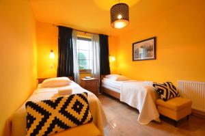 Postel nebo postele na pokoji v ubytování Hotel Dworek nad Regą