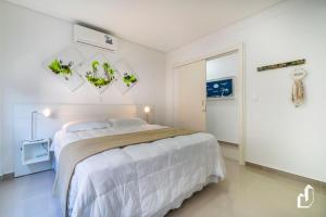 Ένα ή περισσότερα κρεβάτια σε δωμάτιο στο Apartamento 02 dormitórios