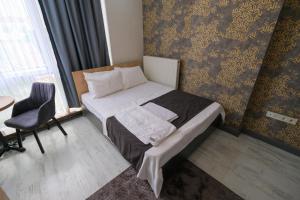 Postel nebo postele na pokoji v ubytování Minimalist Suit Otel