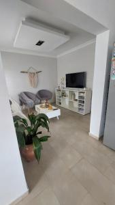 a living room with a couch and a table at La beethoven YB in Yerba Buena