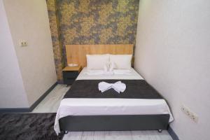 Postel nebo postele na pokoji v ubytování Minimalist Suit Otel