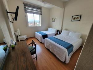 Voodi või voodid majutusasutuse HOTEL TRUEBA toas