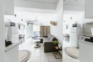 a living room with a couch and a table at Elysium in Volos