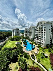 an aerial view of a resort with a swimming pool at Luxury Condo at Jaco Bay, Costa Rica's best beach in Jacó