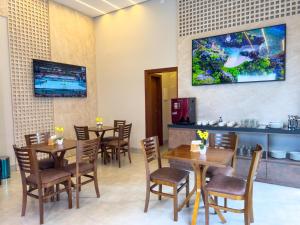 TV a/nebo společenská místnost v ubytování Ondara Flat Hotel