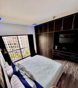 a bedroom with a large bed and a large window at Luxury Condo at Jaco Bay, Costa Rica's best beach in Jacó +62 photos