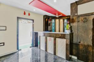 a lobby of a house with a bar at Capital O Geeta Palace in Mumbai