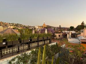 a view of a city from the roof of a building at CASA MAC San Miguel de Allende in San Miguel de Allende