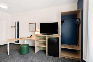 TV a/nebo společenská místnost v ubytování Spark By Hilton Longview
