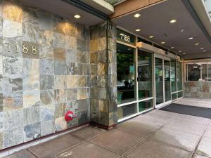 a building with a fire hydrant on the side of it at SureStay by Best Western Richmond Vancouver Airport in Richmond