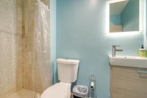 a bathroom with a toilet and a shower and a sink at Walk to Red Jade Park Upper Marlboro Townhome in Largo +20 photos