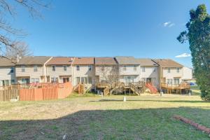 an image of an apartment complex with an orange fence at Walk to Red Jade Park Upper Marlboro Townhome in Largo