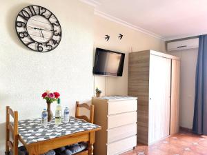 A television and/or entertainment centre at Costa Del Sol Seaside Studio - 5 Mins From Beach