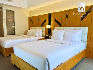 Postel nebo postele na pokoji v ubytování Sotogrande Davao Hotel