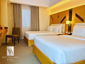 Postel nebo postele na pokoji v ubytování Sotogrande Davao Hotel