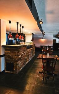 a bar in a restaurant with tables and chairs at The Ascot Motel in Hornsby +24 photos