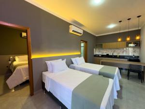 Postel nebo postele na pokoji v ubytování Ondara Flat Hotel