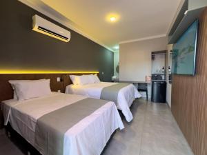 Postel nebo postele na pokoji v ubytování Ondara Flat Hotel