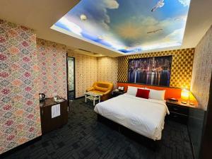 Ένα ή περισσότερα κρεβάτια σε δωμάτιο στο Wecity Hotel 薇城精緻旅店
