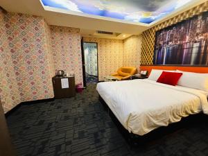 Ένα ή περισσότερα κρεβάτια σε δωμάτιο στο Wecity Hotel 薇城精緻旅店