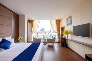 Postel nebo postele na pokoji v ubytování Sandals Hotel