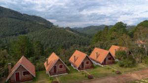 an aerial view of a row of houses in the mountains at Pousada Recanto do Sauá - Monte Verde in Monte Verde