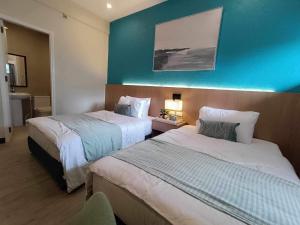 Voodi või voodid majutusasutuse Kimtons Apartment Suite Capitol Site toas