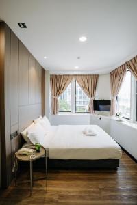 Postel nebo postele na pokoji v ubytování Wangs Hotel Gurney Drive + 90 fotografií