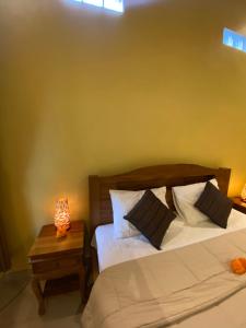 Postel nebo postele na pokoji v ubytování Bali Asli Guest House by EPS