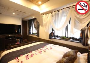 Lova arba lovos apgyvendinimo įstaigoje HOTEL PetitBali Higashi-Shinjuku