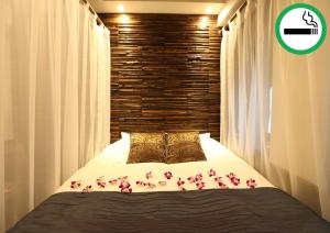 Lova arba lovos apgyvendinimo įstaigoje HOTEL PetitBali Higashi-Shinjuku