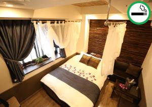 Lova arba lovos apgyvendinimo įstaigoje HOTEL PetitBali Higashi-Shinjuku