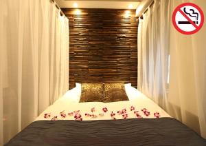 Lova arba lovos apgyvendinimo įstaigoje HOTEL PetitBali Higashi-Shinjuku