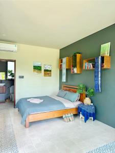 Postel nebo postele na pokoji v ubytování Comfy Riverside Mekong homestay Ben Tre