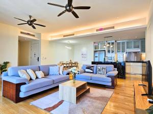 a living room with a couch and a table at St Mary Kuala Lumpur Homestay Bathtub & Walk to Pavilion Bukit Bintang by Cloud Host in Kuala Lumpur