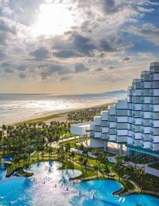 an artist rendering of the proposed resort at the beach at Seaside Skyway apartment Cam Ranh Nha Trang in Cam Lâm