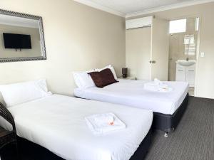 Postel nebo postele na pokoji v ubytování Tropicana Motel