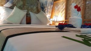 Bayan Exotic Homestay客房内的一张或多张床位