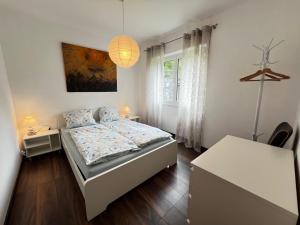 Postel nebo postele na pokoji v ubytování Paradiso in verzasca Motta
