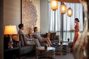 a group of people sitting in a living room at The Ritz-Carlton, Chengdu in Chengdu