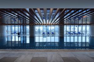 a view of a building with tables and chairs at The Ritz-Carlton, Chengdu in Chengdu